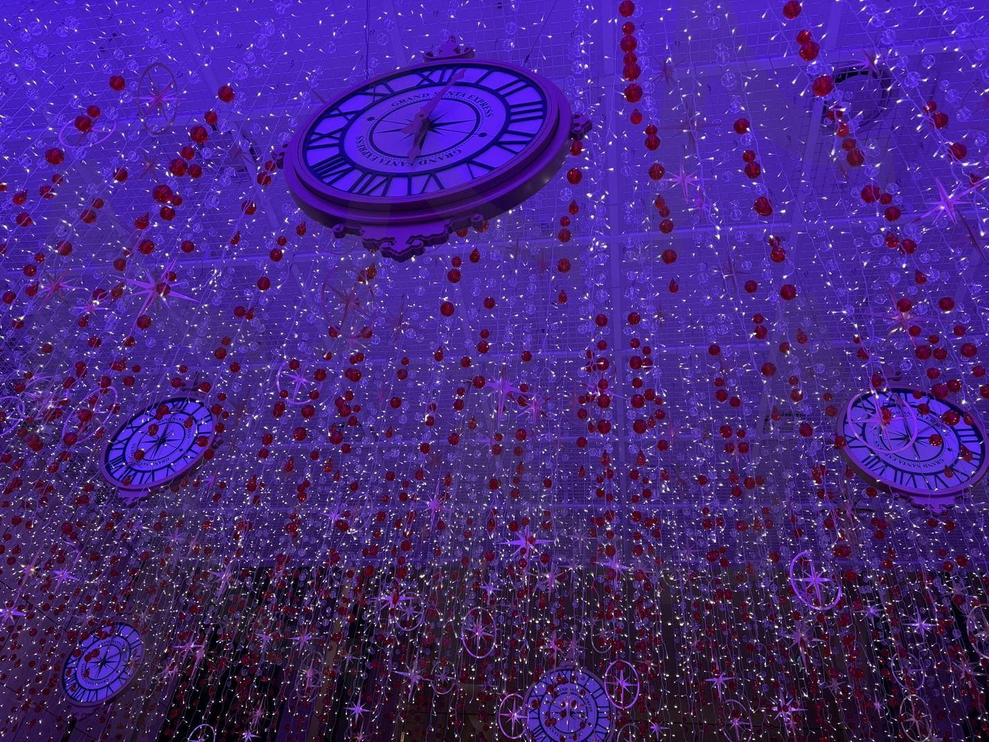 Whimsical Time-Themed Light Installation | Time-themed installation, clock decor, fairy lights, immersive art, dreamlike ambiance, surreal lighting, festive decorations, Roman numerals, whimsical design, fantasy aesthetics. | 스탠바이 STANDBUY 디지털 콘텐츠